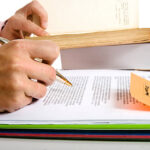 Pen and Pile of books for Study and Research